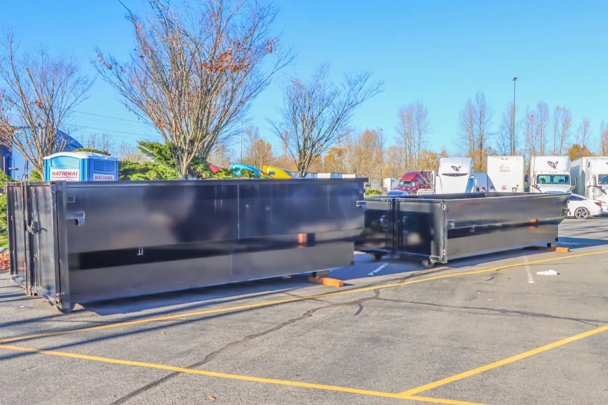 Professional dumpster rental service with roll-off container on residential driveway in Alondra Park